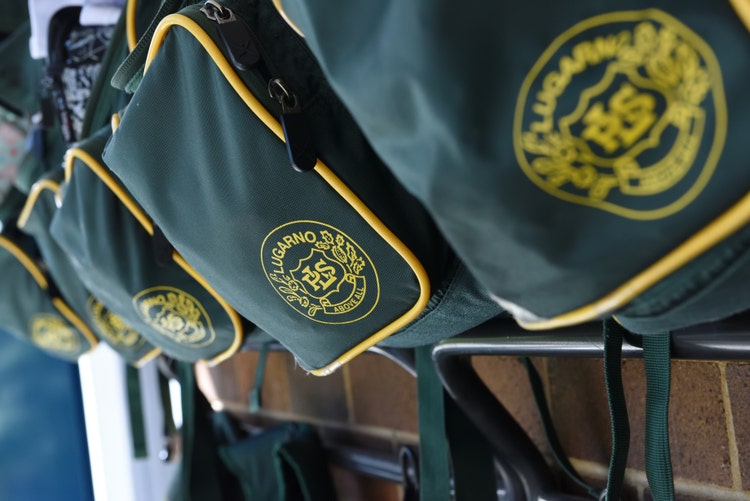 Photo of school bags on hooks